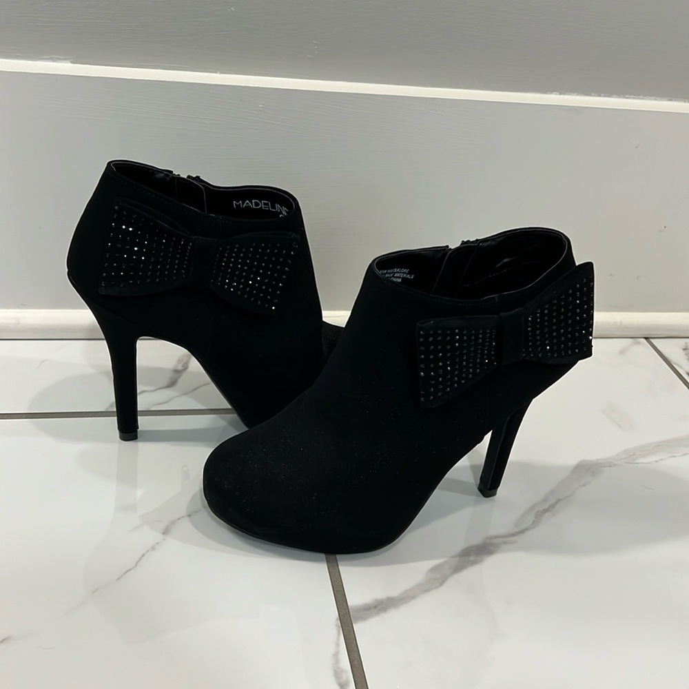 Black booties with studded bow detail